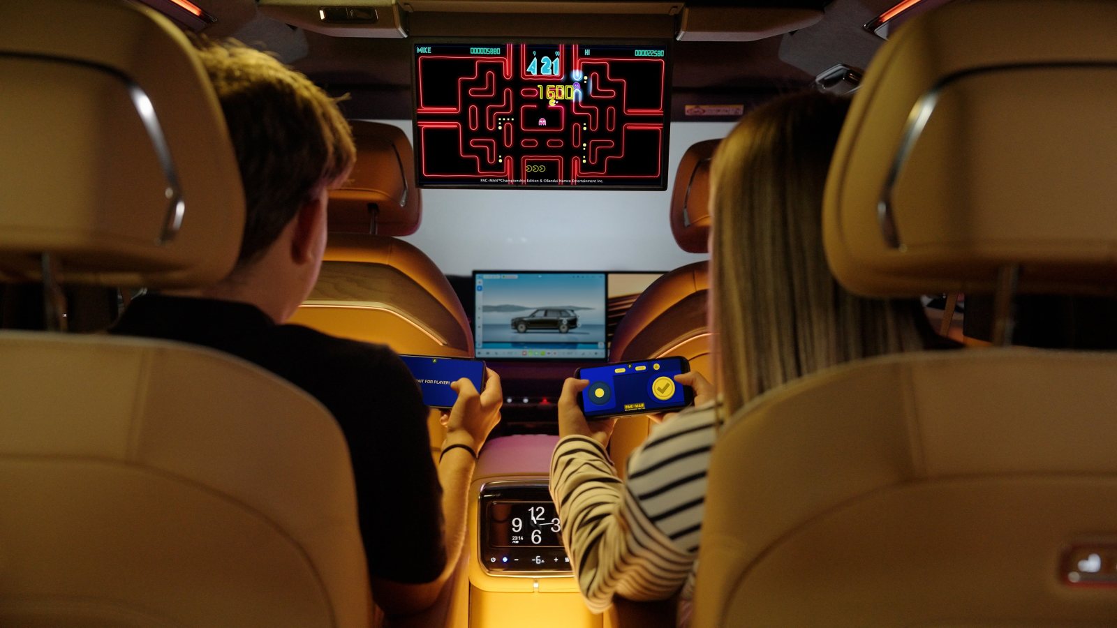 Two passengers enjoy AirConsole in-car gaming in a Zeekr, using their smartphones as controllers