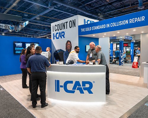 Attendees at the I-CAR booth
