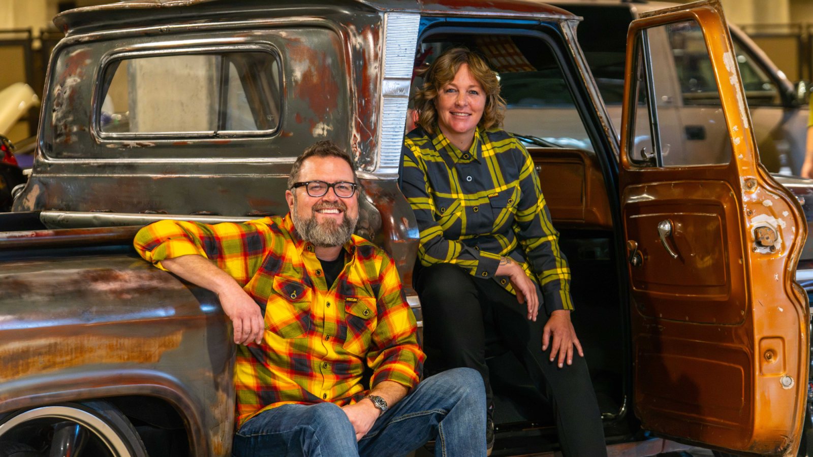 The limited-edition Mecum Auctions X Greasy Hands Society flannels, shown with a patina pickup truck. Photo courtesy of Mecum Auctions.