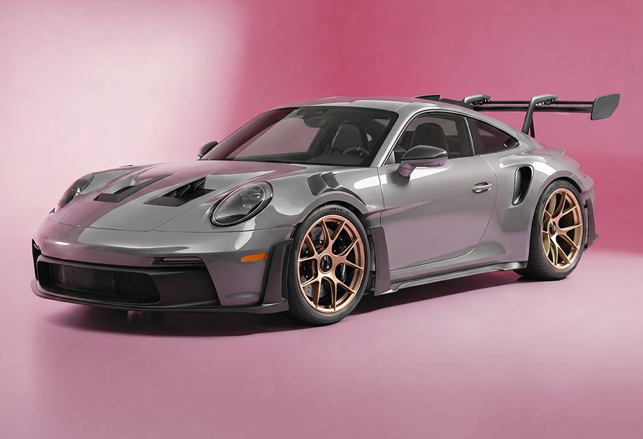 Porsche 911 GT3 RS wrapped in metallic-silver PrismaPro color PPF against a pink studio backdrop (verified PNG, 920x628)